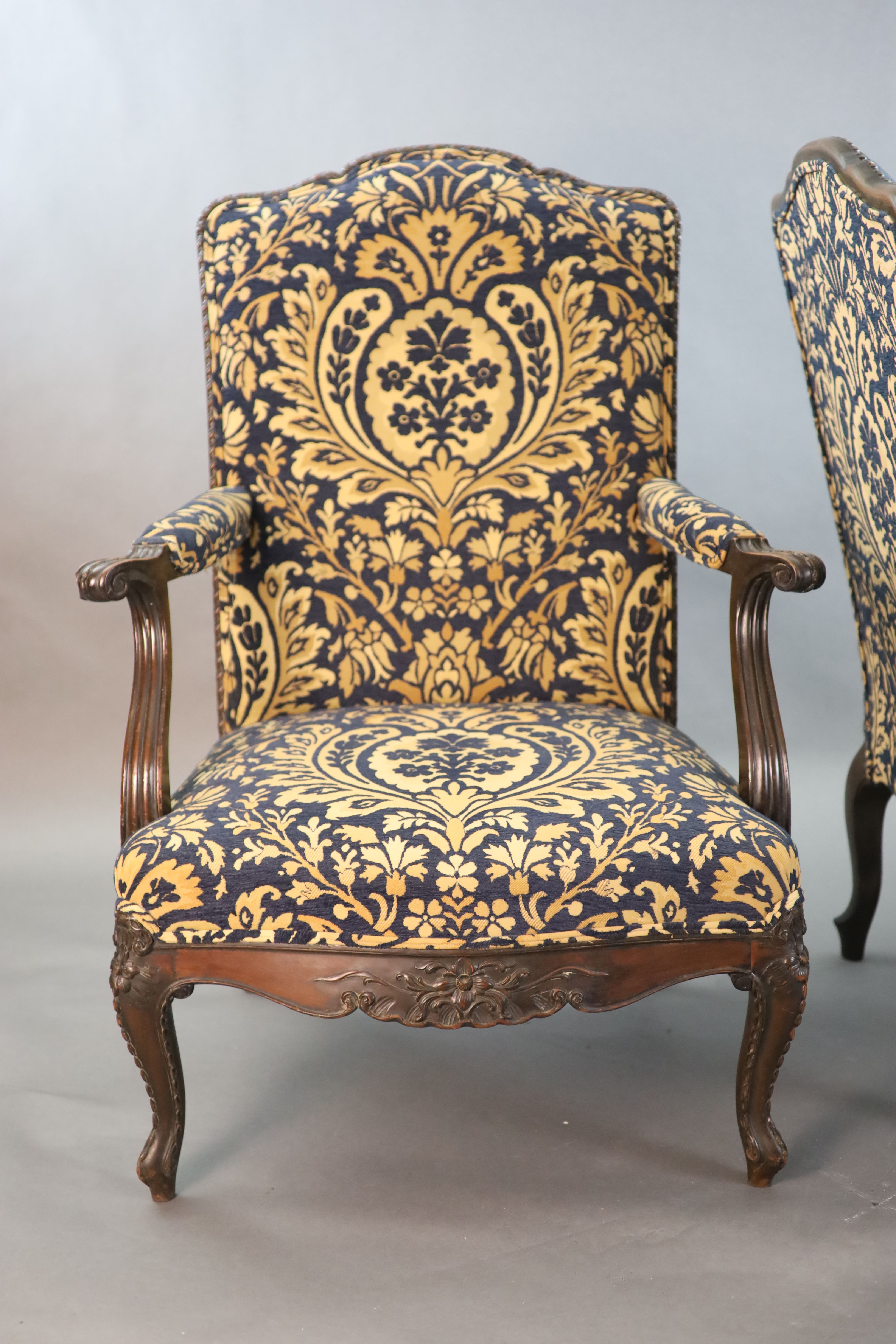 A pair of Louis XVI style mahogany fauteuils, W.2ft 6in. D.2ft 5in. H.3ft 6in.